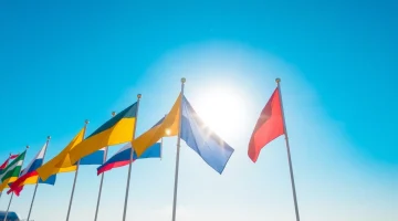 Colorful beach flags indicate safety levels at the shore, enhancing beach safety awareness.